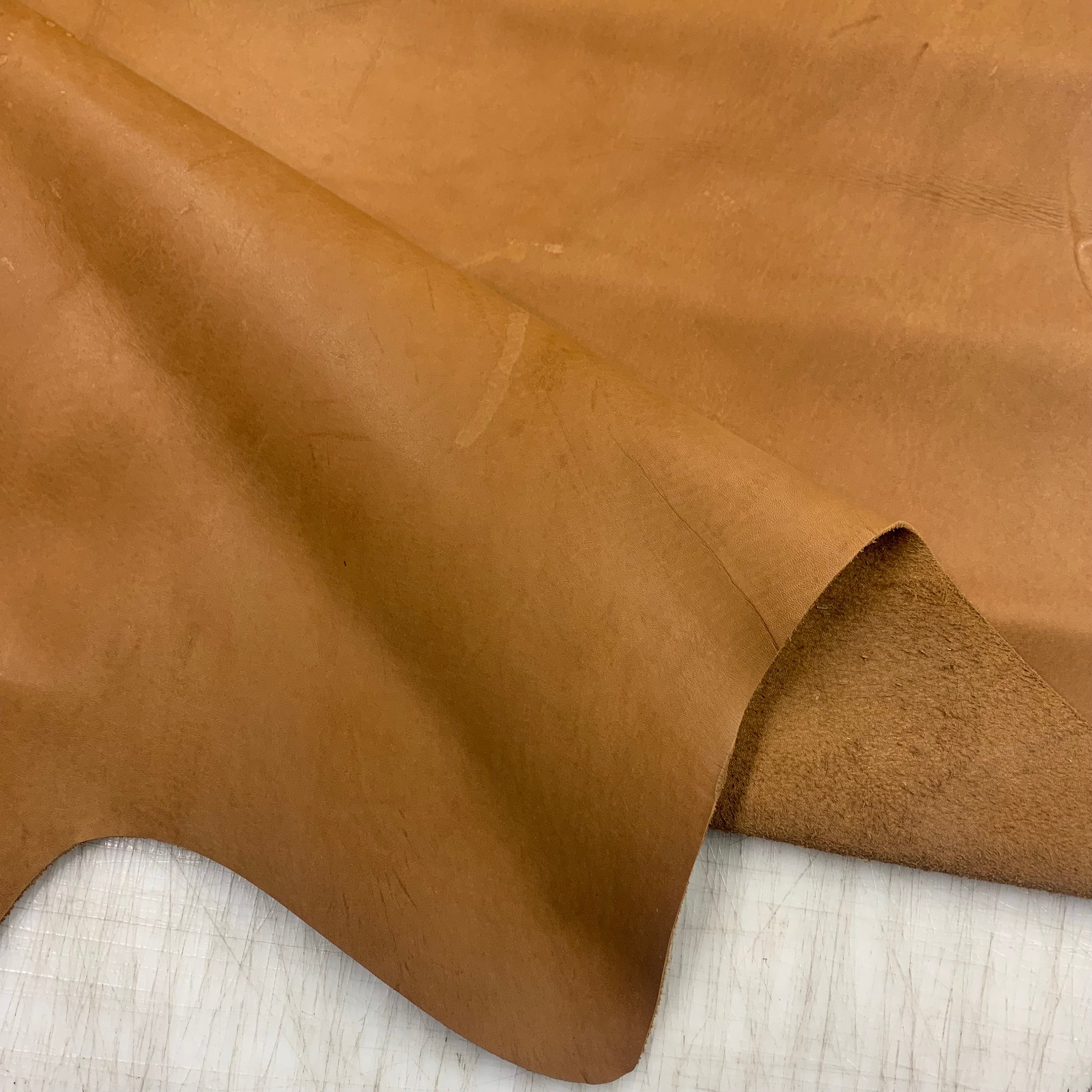 Natural leather | light brown tan | 1.3-1.5mm | 3-4 oz | Medum stiff | Rustic vintage style with natural imperfections scars